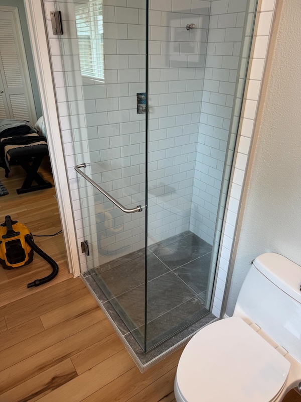 Walk in shower with large glass pieces