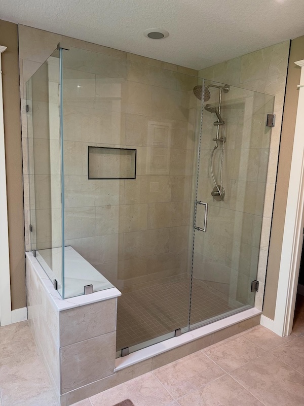 Large all glass enclosed shower in a bathroom