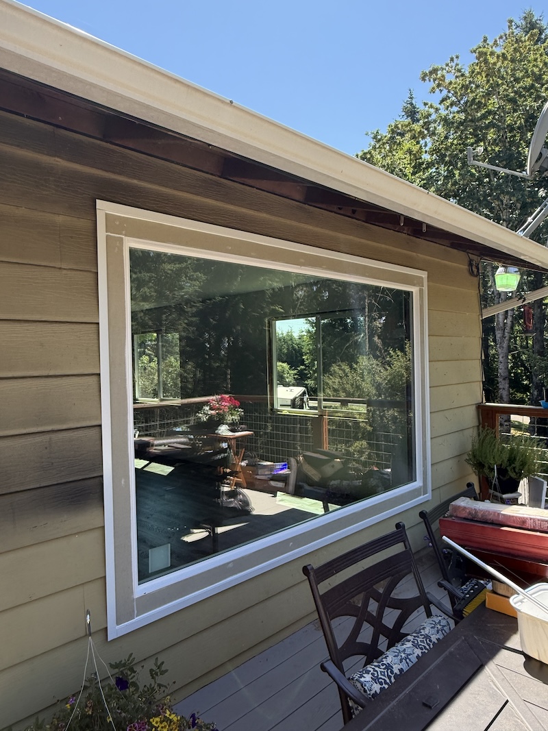IMG_0396 Large glass window overlooking the deck on the side of a house