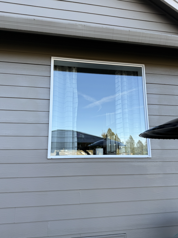 Screenshot 2025-09-30 at 8.32.17 PM Large glass window on the side of a house